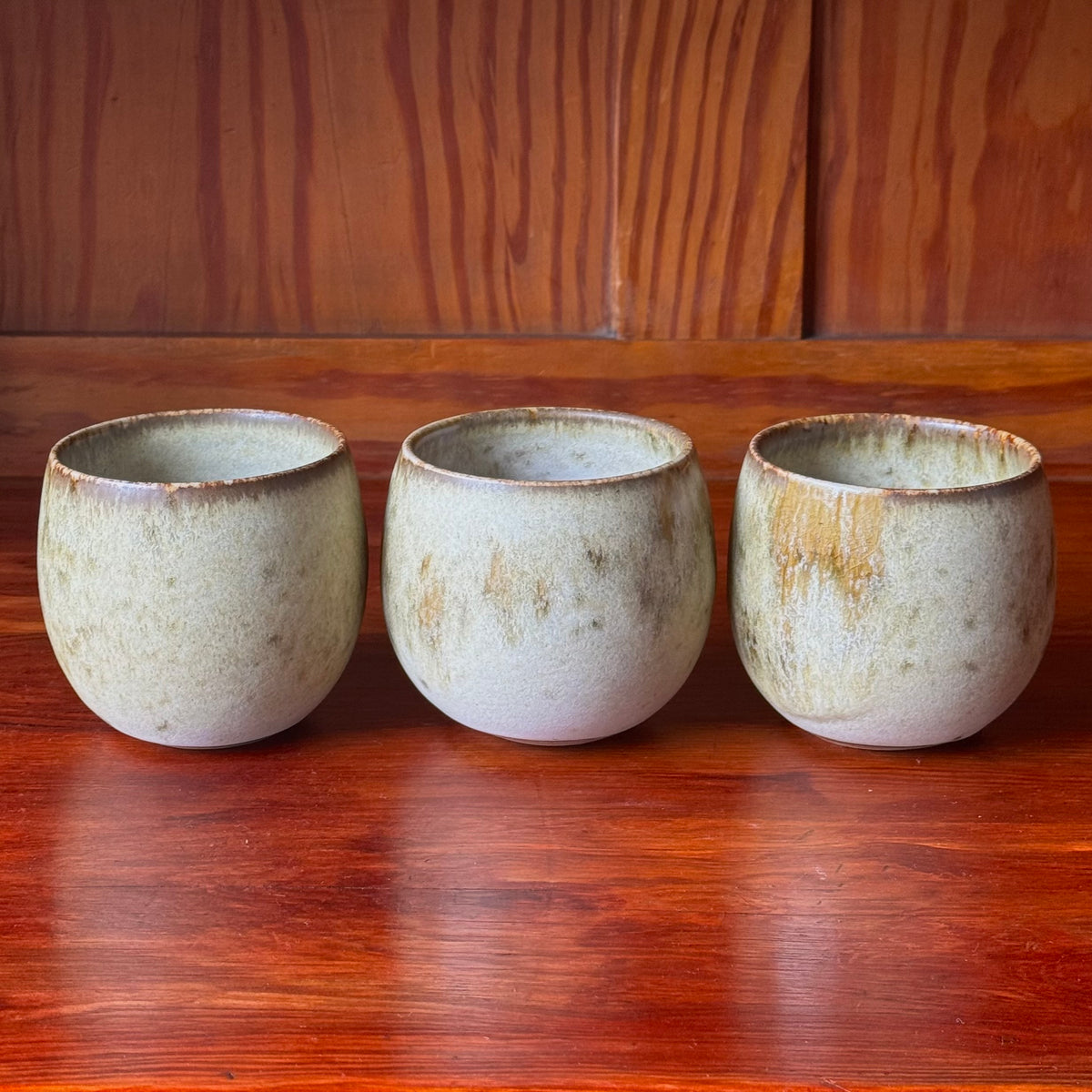 A handcrafted ceramic cup by Kasper Würtz, a Danish ceramicist renowned for his hand-thrown and hand-glazed stoneware. Inspired by Nordic utilitarian crafts and British studio pottery, the design features a balanced inner-outer ratio, subtle concavity, and a glaze that harmoniously blends matte and glossy finishes. Diameter: 7.5 cm, Height: 7.5 cm.