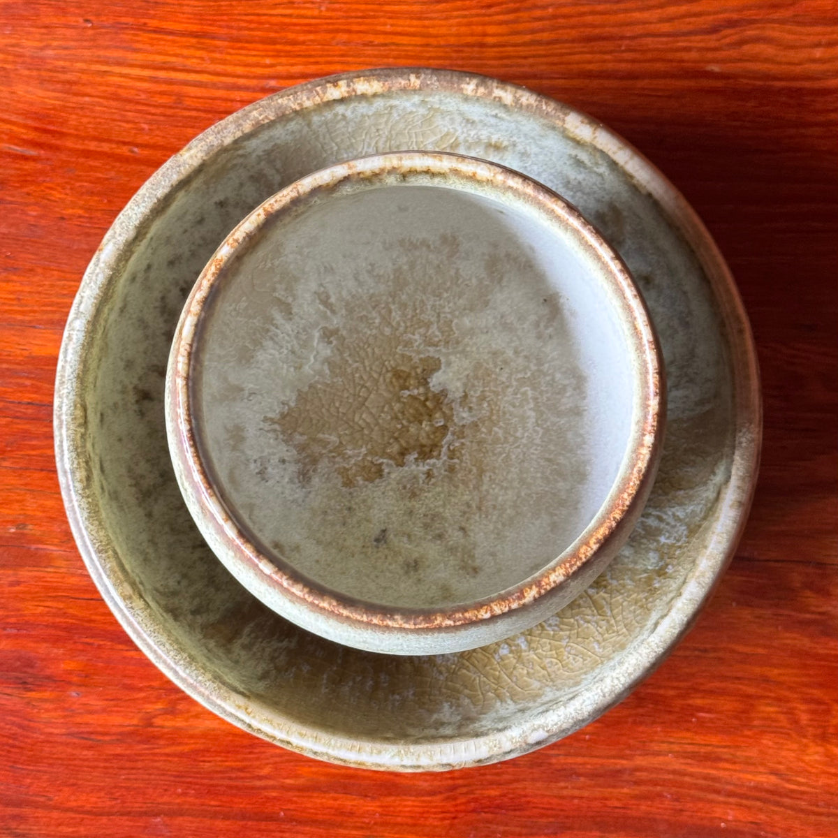A handcrafted ceramic cup by Kasper Würtz, a Danish ceramicist renowned for his hand-thrown and hand-glazed stoneware. Inspired by Nordic utilitarian crafts and British studio pottery, the design features a balanced inner-outer ratio, subtle concavity, and a glaze that harmoniously blends matte and glossy finishes. Diameter: 7.5 cm, Height: 7.5 cm.