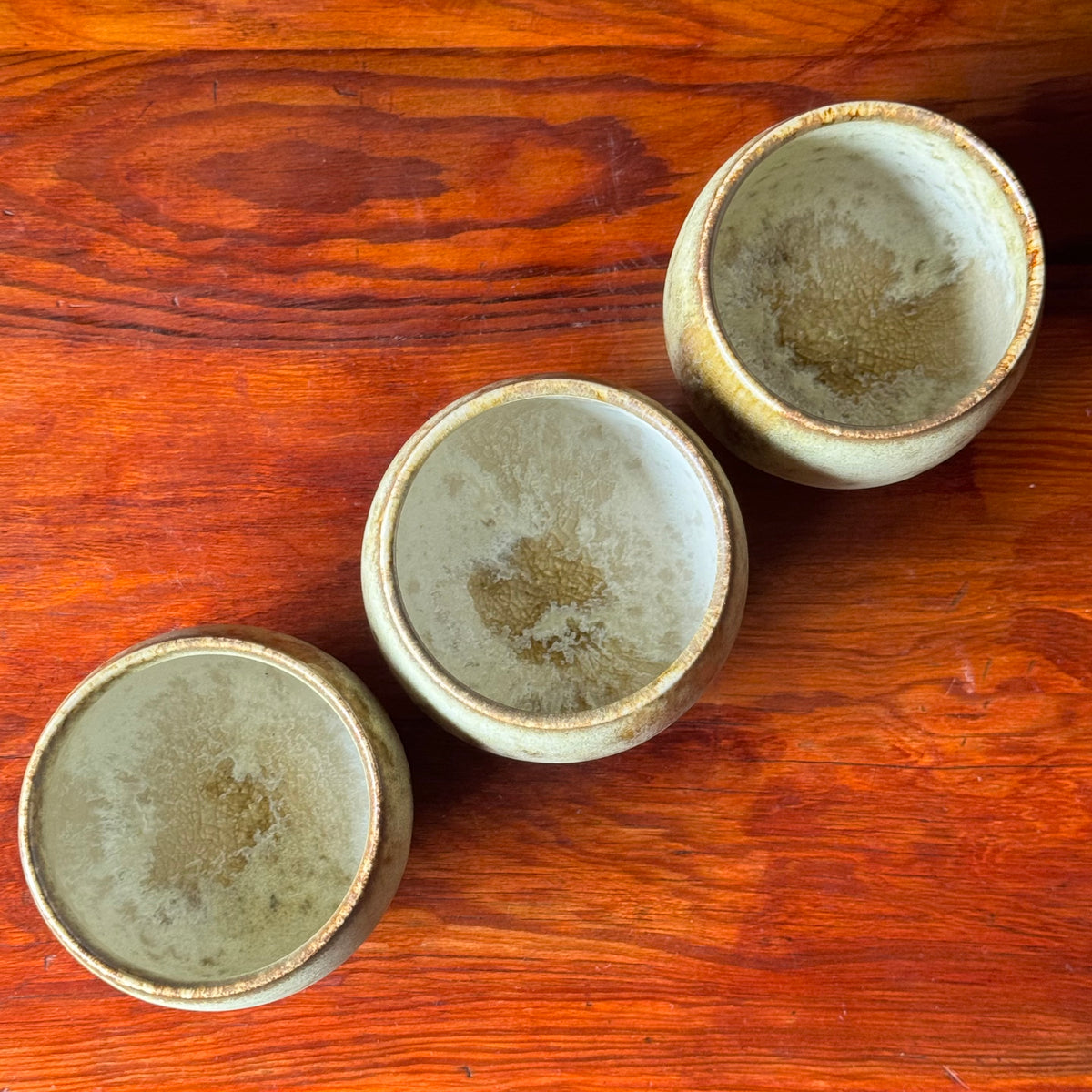 A handcrafted ceramic cup by Kasper Würtz, a Danish ceramicist renowned for his hand-thrown and hand-glazed stoneware. Inspired by Nordic utilitarian crafts and British studio pottery, the design features a balanced inner-outer ratio, subtle concavity, and a glaze that harmoniously blends matte and glossy finishes. Diameter: 7.5 cm, Height: 7.5 cm.