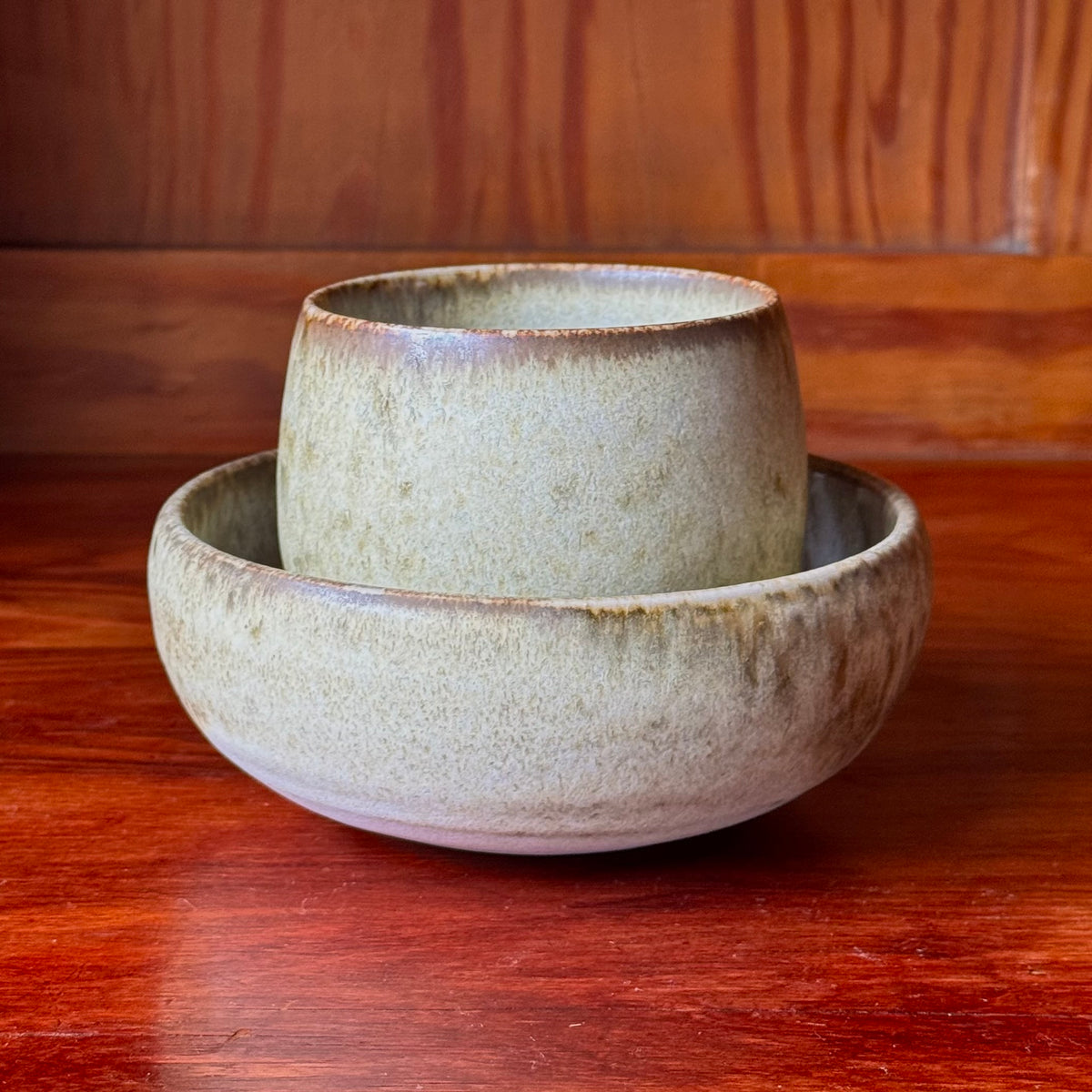 A handcrafted ceramic cup by Kasper Würtz, a Danish ceramicist renowned for his hand-thrown and hand-glazed stoneware. Inspired by Nordic utilitarian crafts and British studio pottery, the design features a balanced inner-outer ratio, subtle concavity, and a glaze that harmoniously blends matte and glossy finishes. Diameter: 7.5 cm, Height: 7.5 cm.