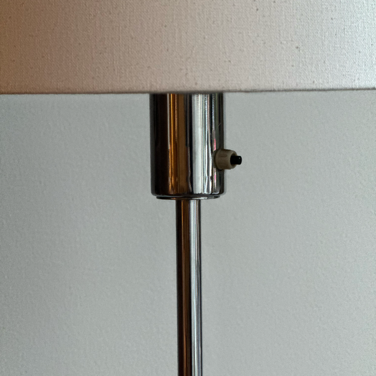 A vintage 1960s full-length floor lamp by Philips Netherlands, featuring a sleek steel frame complemented by leather accents. This mid-century modern design combines industrial materials with refined craftsmanship, offering both style and functionality.