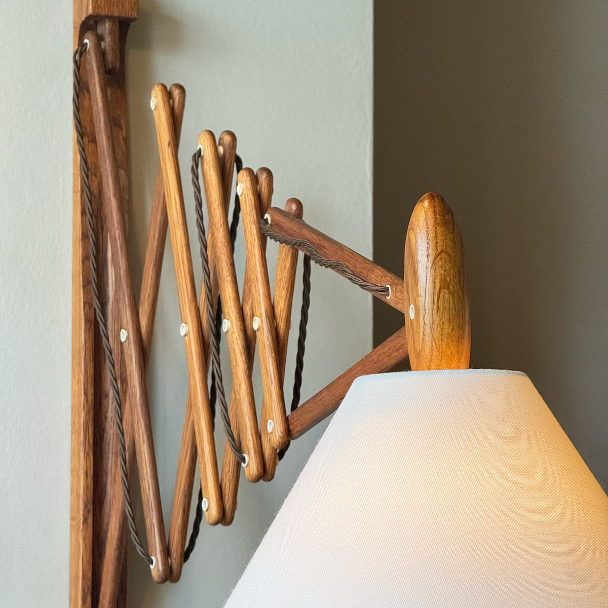 A wooden 'Sax' (scissor) wall lamp designed by Erik Hansen for Le Klint, Denmark, 1952.