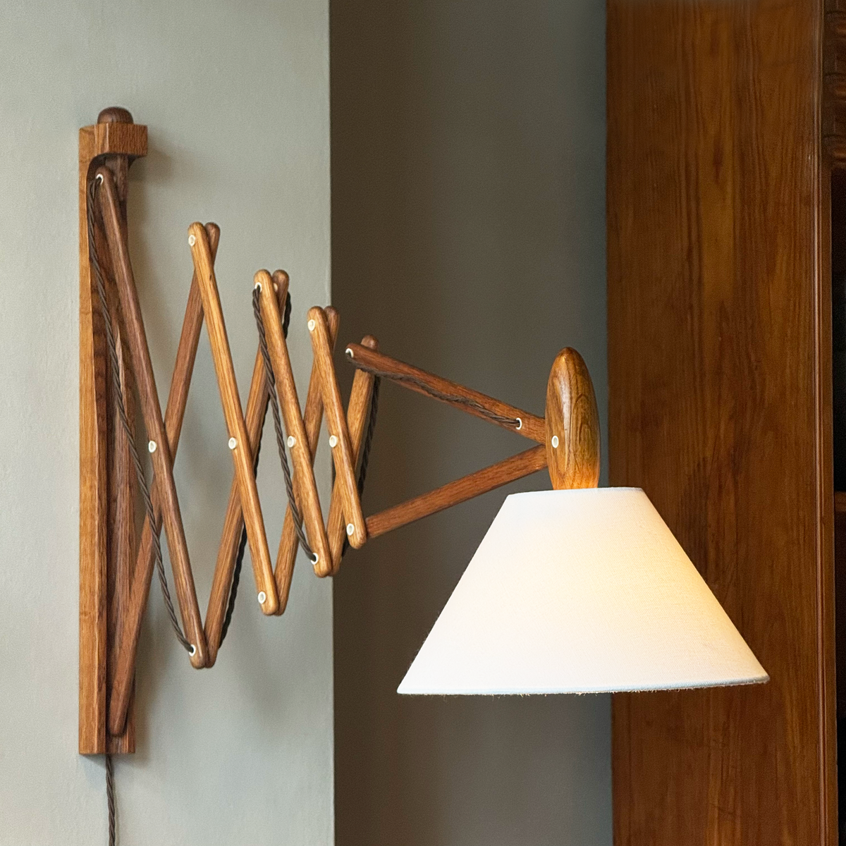 A wooden 'Sax' (scissor) wall lamp designed by Erik Hansen for Le Klint, Denmark, 1952.