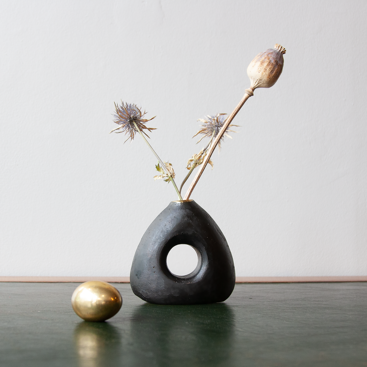 See-Through Vase #3787 by Werkstätte Carl Auböck, a sculptural solid brass object showcasing the workshop’s signature modernist design. This elegantly crafted piece blends functionality with artistic form, embodying Auböck’s timeless aesthetic.