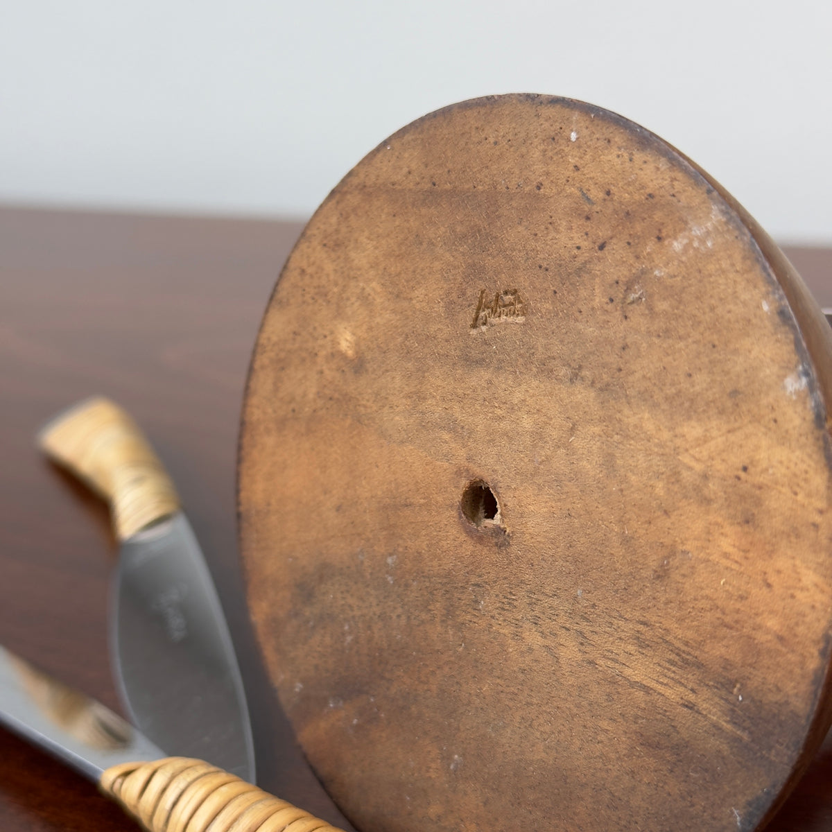 A vintage fruit knife set designed by Carl Auböck from the 1950s, featuring handles wrapped in cane. This full set exemplifies Austrian modernist design, combining functional elegance with the innovative use of natural materials, characteristic of midcentury modernism
