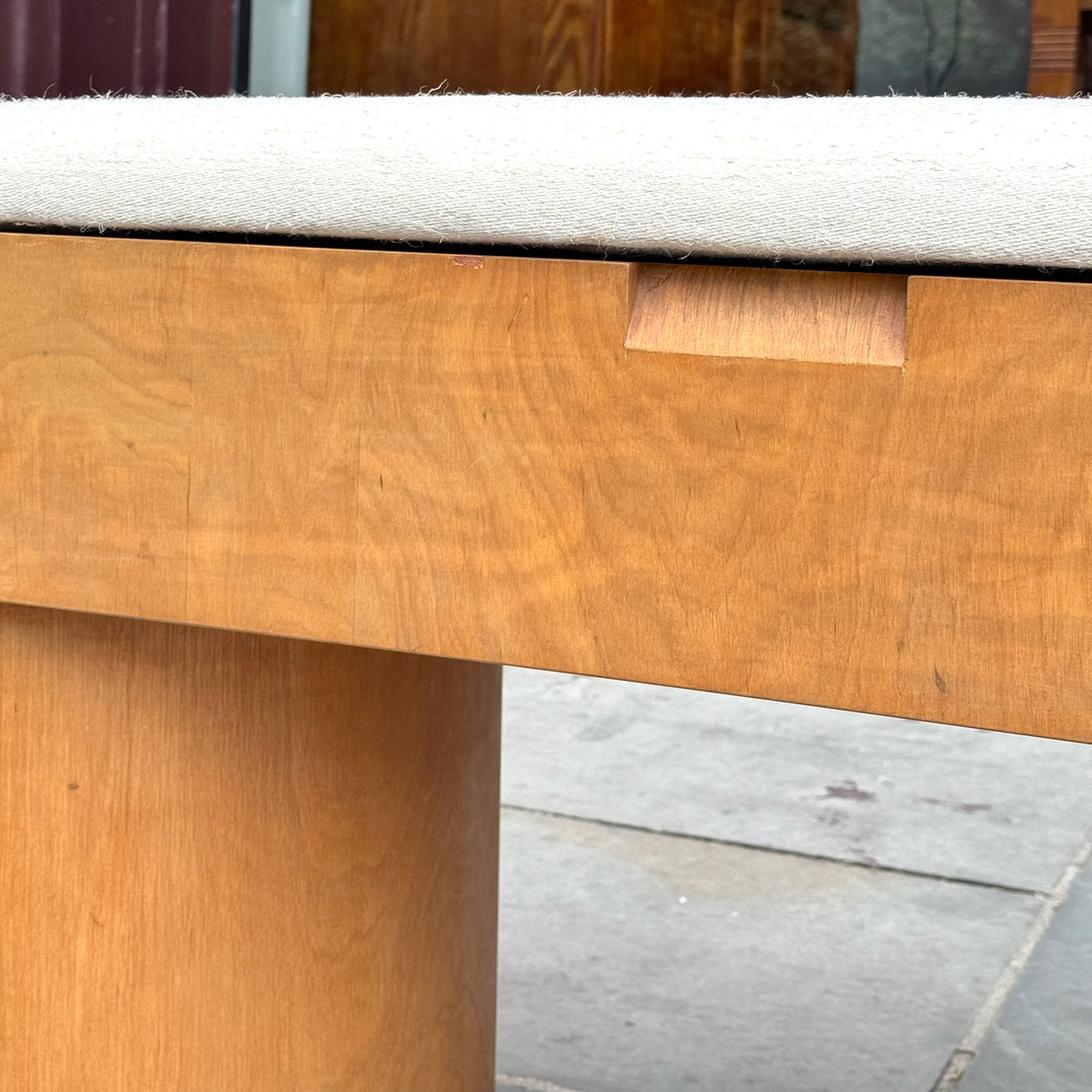 An upholstered plywood bench designed by British Modernist, Gerald Summers and manufactured by his company, Makers of Simple Furniture (1931-1940).