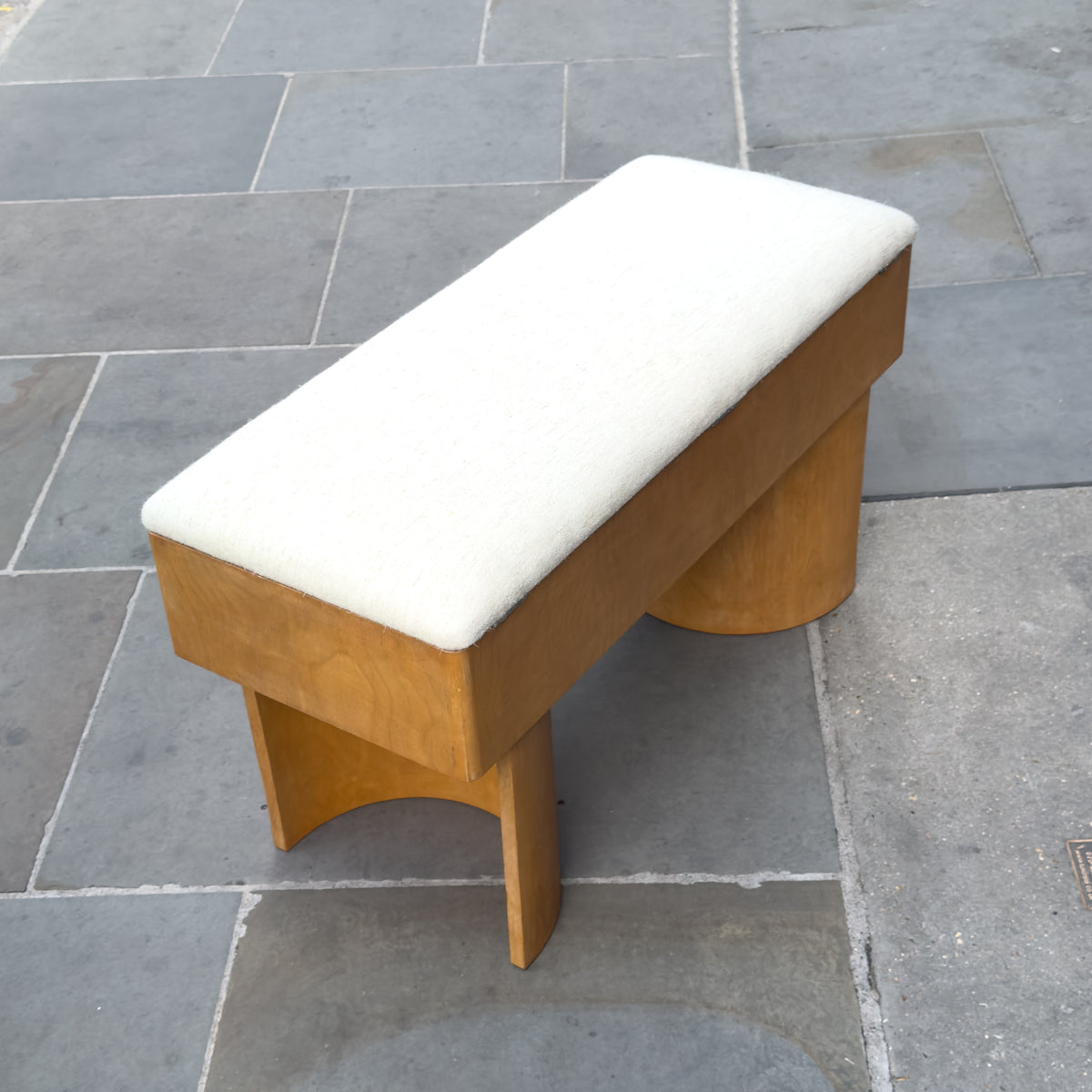 An upholstered plywood bench designed by British Modernist, Gerald Summers and manufactured by his company, Makers of Simple Furniture (1931-1940).