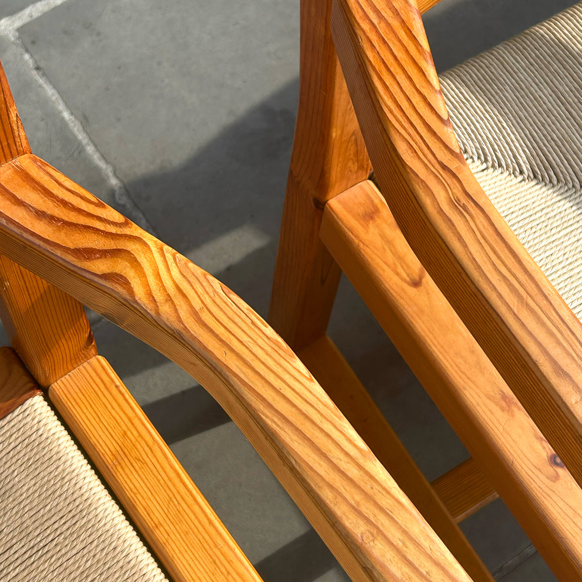 A set of 6 danish pine dining chairs with paper cord seats, pictured outside antiques dealership, Sigmar. 