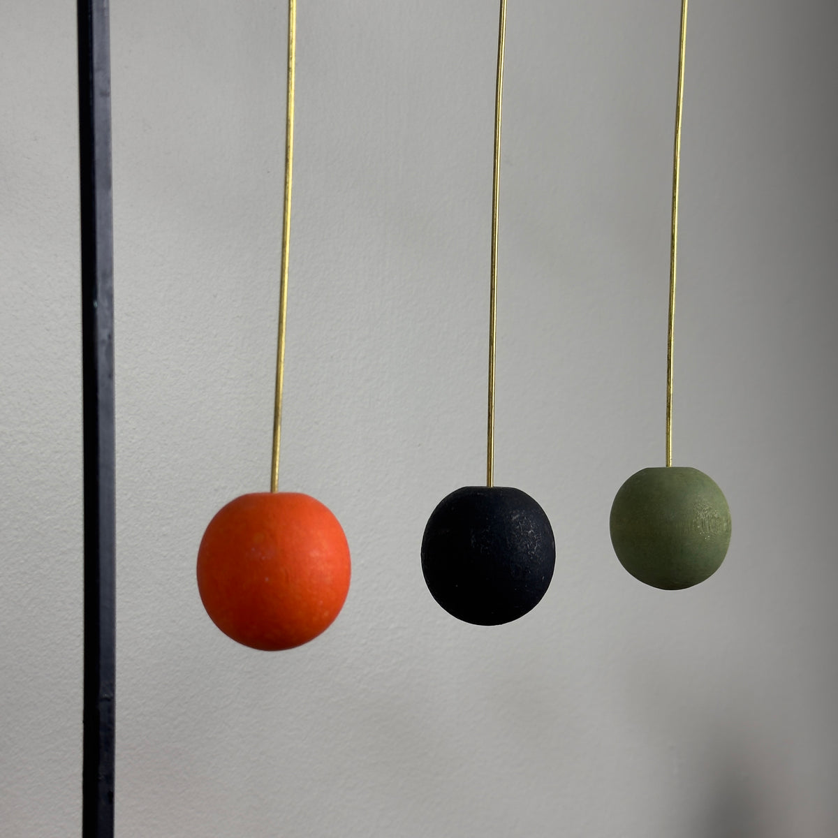 A kinetic candelabrum designed by Thomas Hellström in the 1950s, crafted in Sweden. This unique piece reinterprets Swedish folk aesthetics, blending traditional design elements with a dynamic, mid-century modern twist.
