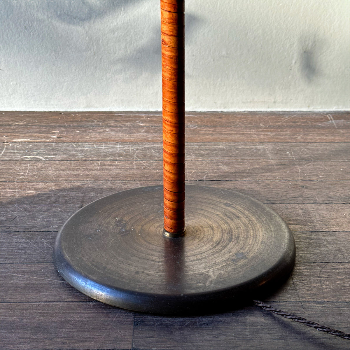 An original vintage leather-bound brass telescopic floor lamp from Denmark. This mid-century piece features an adjustable design with a rich patina, available from Sigmar London.