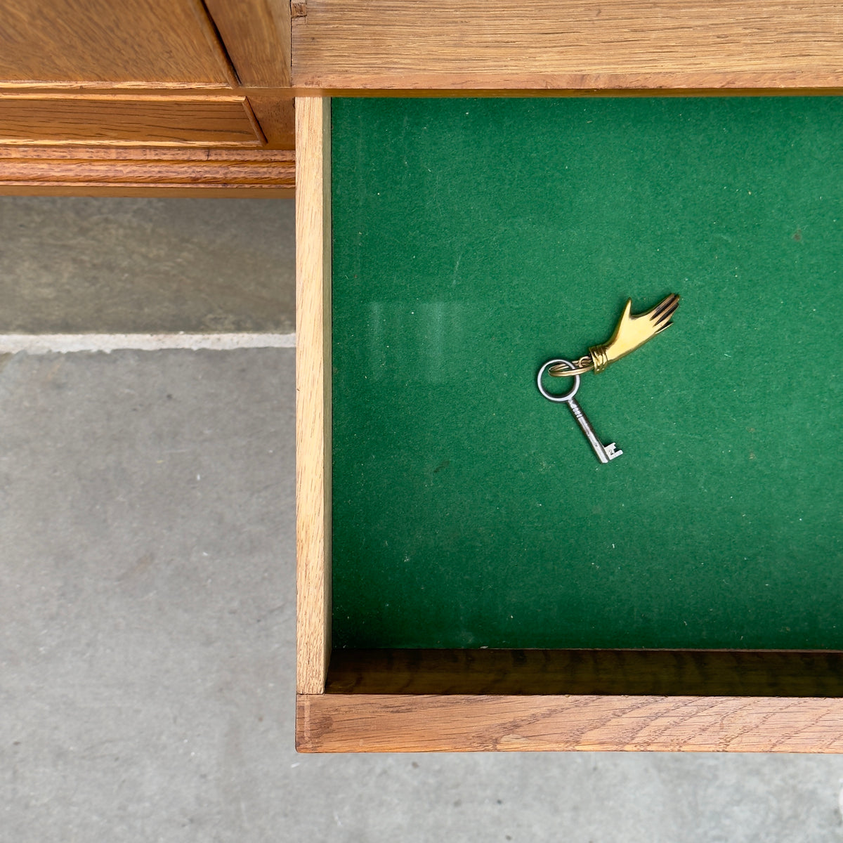 A tall oak cabinet designed by Ole Wanscher and crafted by A.J. Iversen in Denmark. This midcentury piece exemplifies Danish modern design with its refined craftsmanship and timeless elegance.