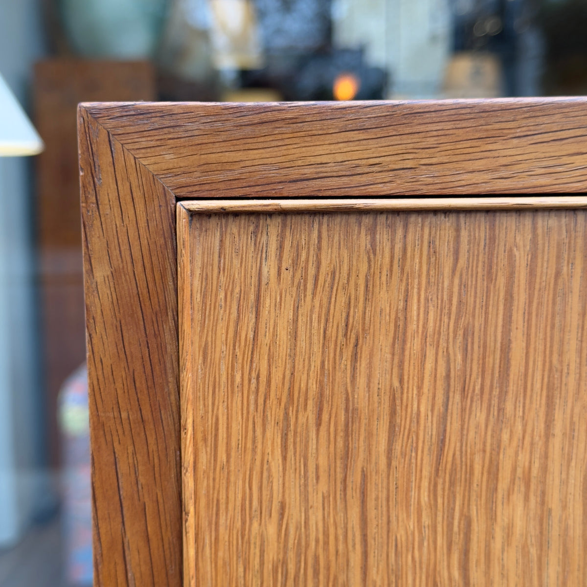 A tall oak cabinet designed by Ole Wanscher and crafted by A.J. Iversen in Denmark. This midcentury piece exemplifies Danish modern design with its refined craftsmanship and timeless elegance.