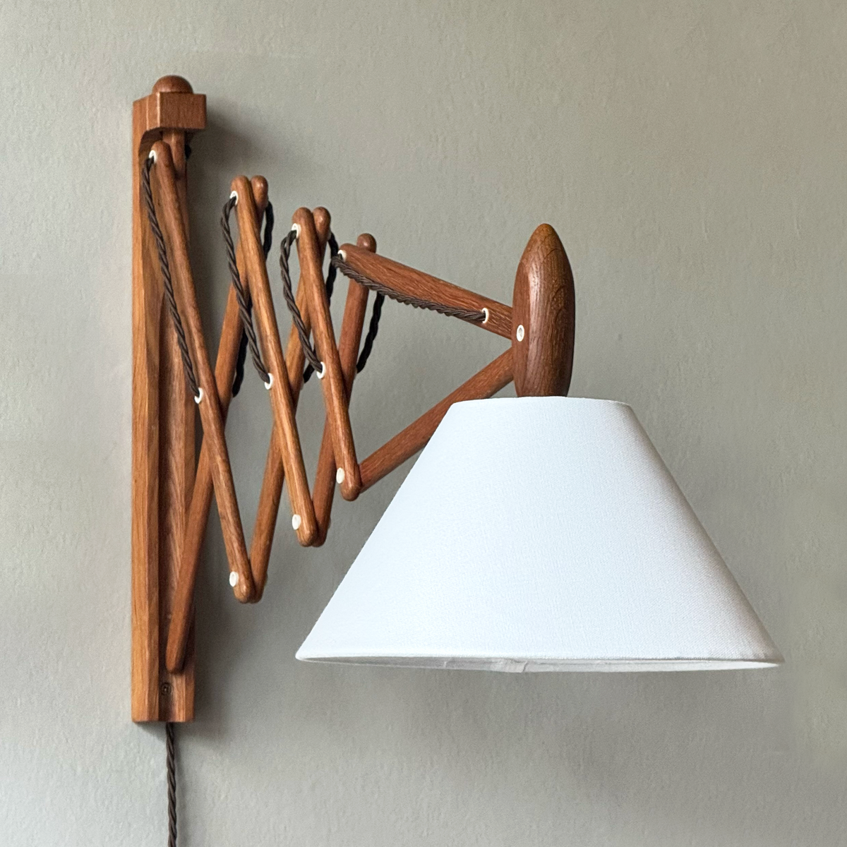 A wooden 'Sax' (scissor) wall lamp designed by Erik Hansen for Le Klint, Denmark, 1952.