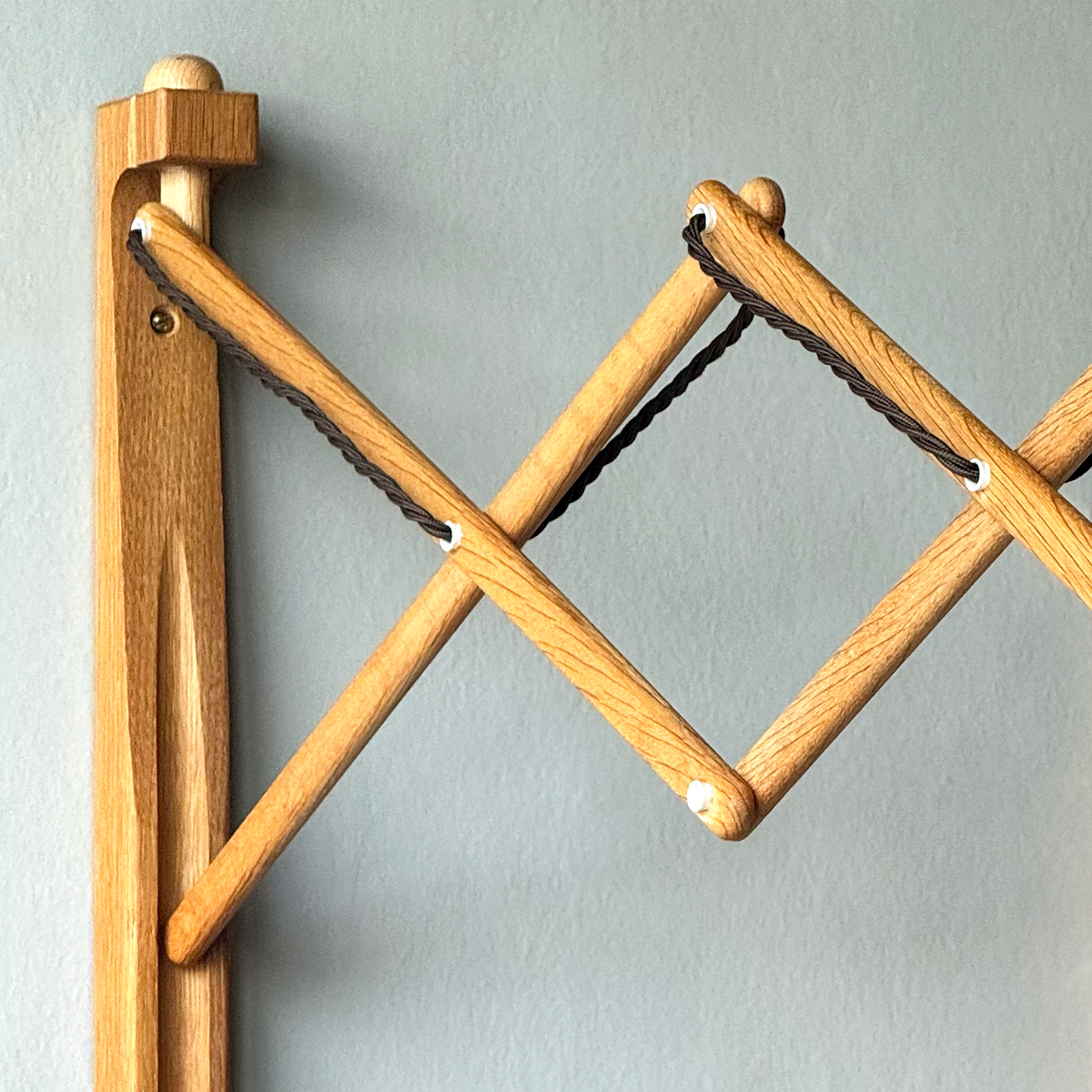 A wooden 'Sax' (scissor) wall lamp designed by Erik Hansen for Le Klint, Denmark, 1952.