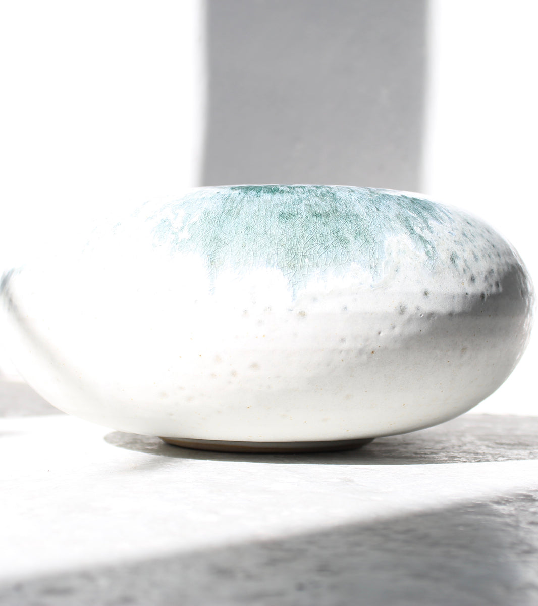 Curling Stone Shaped Vase <br> White & Teal Glaze