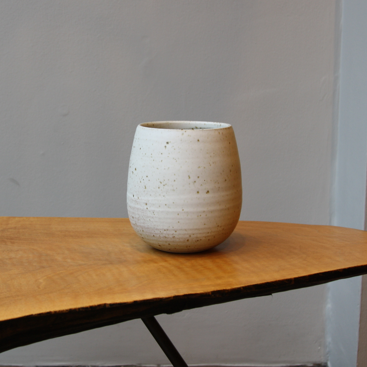 Small speckled ivory bulb shaped vase