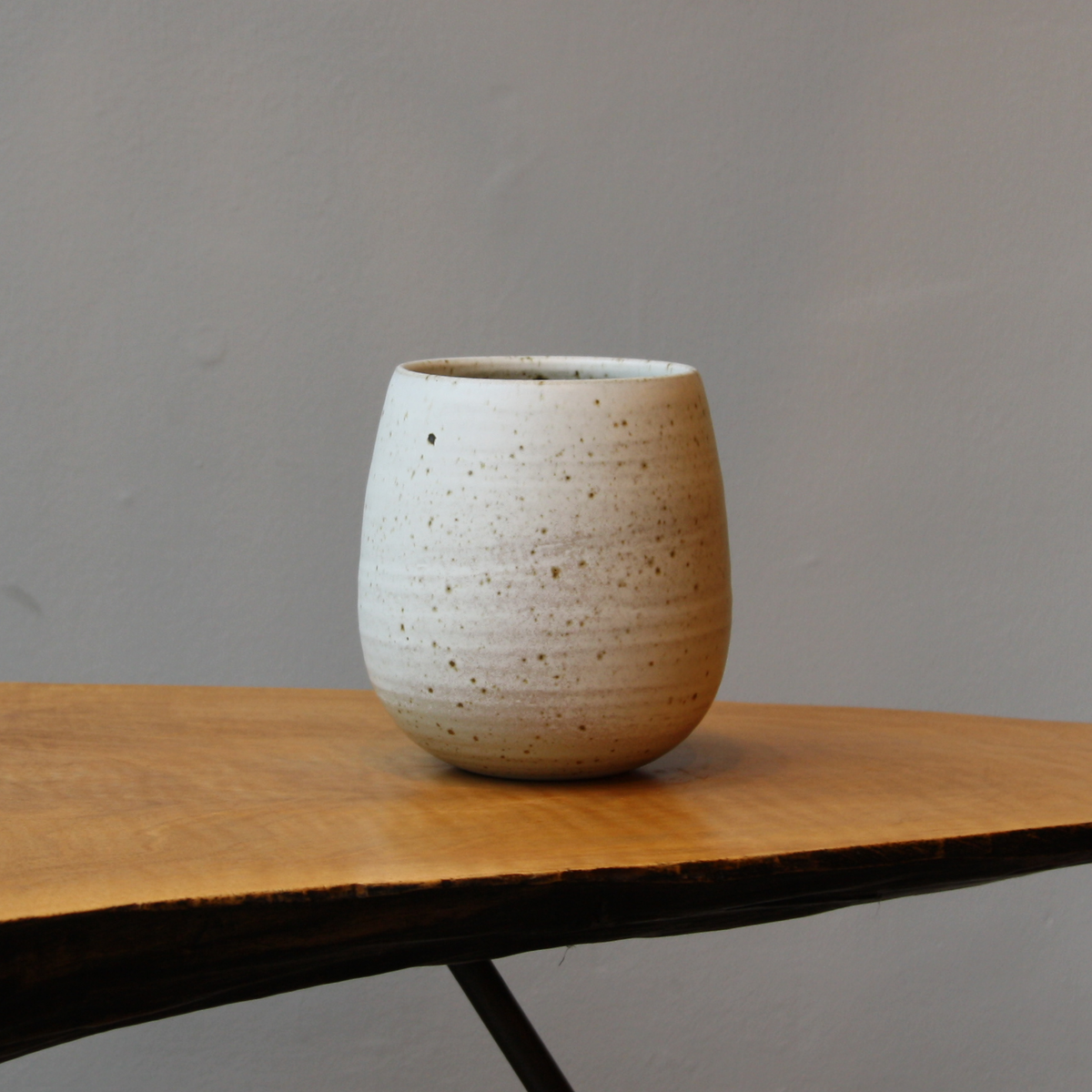 Small speckled ivory bulb shaped vase