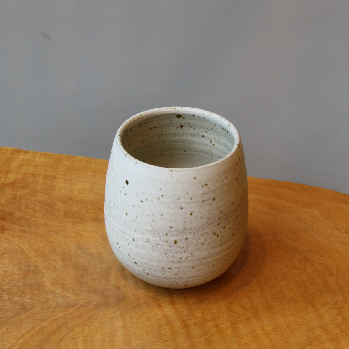 Small speckled ivory bulb shaped vase